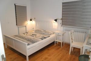 a bedroom with a bed and a table and a chair at Mountain View Retreat Mionica in Kosjeric +39 photos