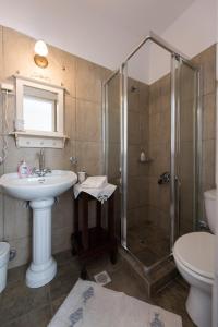 a bathroom with a sink and a shower at Villa Areto in Kamares