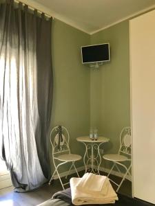 TV a/nebo společenská místnost v ubytování L'Arena Residence