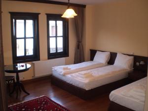 Ένα ή περισσότερα κρεβάτια σε δωμάτιο στο Casa La Kola Krusevo +6 φωτογραφίες