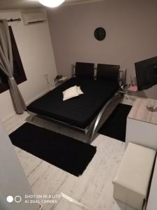 A bed or beds in a room at Oasi