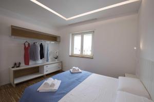 A bed or beds in a room at apARTments Sperlonga