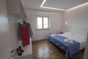 Llit o llits en una habitació de apARTments Sperlonga