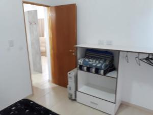 a kitchen with a white counter and a refrigerator at Complejo La Palmera in San Rafael