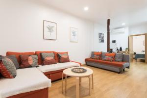 a living room filled with furniture and a couch at Apartments Center Bairro Alto in Lisbon