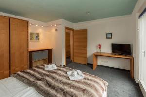 Ένα ή περισσότερα κρεβάτια σε δωμάτιο στο Ibex Lodge