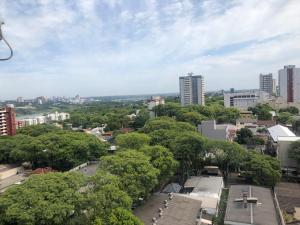 a view of a city with trees and buildings at Loft funcional no centro! in Foz do Iguaçu