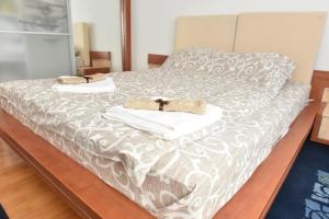 Postel nebo postele na pokoji v ubytování Promenada apartmani