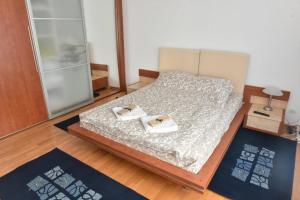 Postel nebo postele na pokoji v ubytování Promenada apartmani