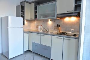 Kuchyň nebo kuchyňský kout v ubytování Promenada apartmani