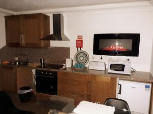 A cozinha ou kitchenette de Meimoa Guesthouse