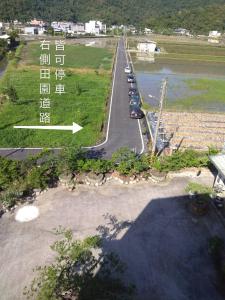 an aerial view of a road next to a river at Moly Homestay in Jiaoxi