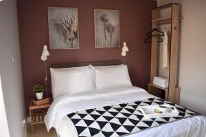 a bedroom with a bed with a tray of food on it at The Spinney in Bracknell