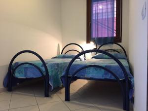 Posteľ alebo postele v izbe v ubytovaní Holiday home in Rosolina Mare 26701