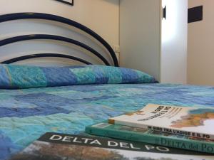 Posteľ alebo postele v izbe v ubytovaní Holiday home in Rosolina Mare 26701