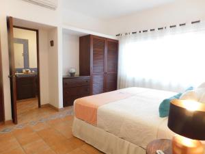 Postel nebo postele na pokoji v ubytování Fabiola Condo Hotel