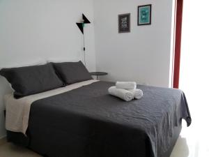 Giường trong phòng chung tại NOVO EDIFICIO VIENA - ATRAS do PRAIA CENTER
