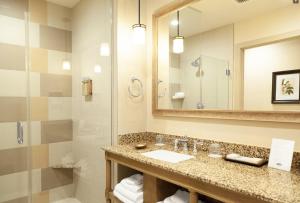 a bathroom with a sink and a shower at Ponte Vineyard Inn in Temecula +50 photos