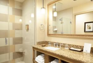 a bathroom with a sink and a shower at Ponte Vineyard Inn in Temecula