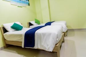 Postel nebo postele na pokoji v ubytování Tourist Inn
