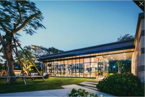 a large building with a lot of windows at Rain cha-am by J in Cha Am