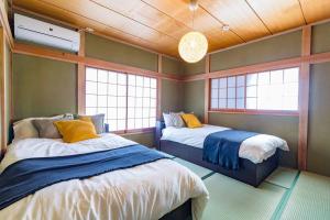 Tempat tidur dalam kamar di enico MtFuji nagomi和
