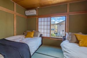 Tempat tidur dalam kamar di enico MtFuji nagomi和