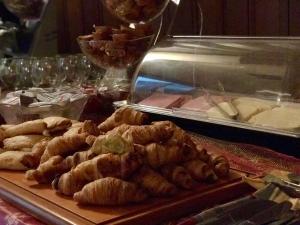 a table with a bunch of pastries on a table at Hotel Epavlis in Drama