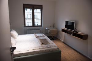 Säng eller sängar i ett rum på Apartment Rotonda