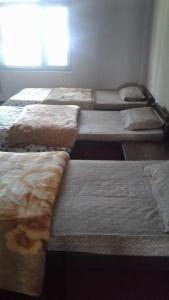 מיטה או מיטות בחדר ב-Lampokhari Village Resort - Aritar
