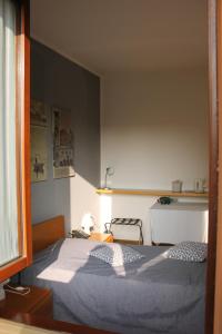 Un pat sau paturi într-o cameră la ALBERGO LA SCALETTA