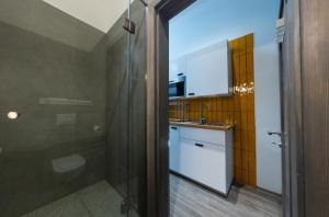Kúpeľňa v ubytovaní BpR Downtown Gemstone Apartments