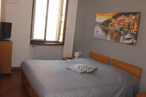 Un pat sau paturi într-o cameră la ALBERGO LA SCALETTA