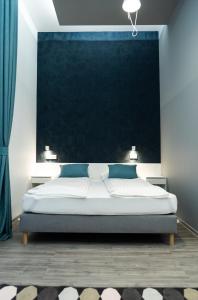Posteľ alebo postele v izbe v ubytovaní BpR Downtown Gemstone Apartments