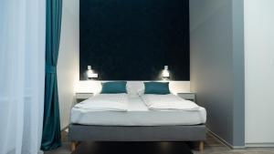 Posteľ alebo postele v izbe v ubytovaní BpR Downtown Gemstone Apartments