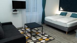 Posteľ alebo postele v izbe v ubytovaní BpR Downtown Gemstone Apartments