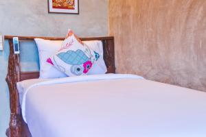 Postel nebo postele na pokoji v ubytování Baan Tubkaek Hotel