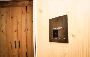 a door with a sign on the side of a wall at Bergruh Steeg in Steeg