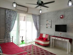 A television and/or entertainment centre at Cheqma D'perdana Apartment Kota Bharu