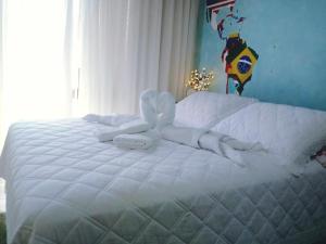 سرير أو أسرّة في غرفة في Vale Aventura