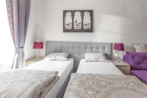 Łóżko lub łóżka w pokoju w obiekcie Babel Hostel