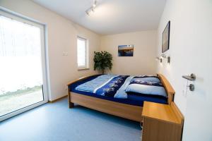 Postel nebo postele na pokoji v ubytování Strandhaus Eden
