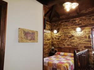 A bed or beds in a room at Apartamentos rurales Casa Do Cabo