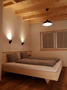 Ένα ή περισσότερα κρεβάτια σε δωμάτιο στο S'Obadoba - Penthouse Falkeis