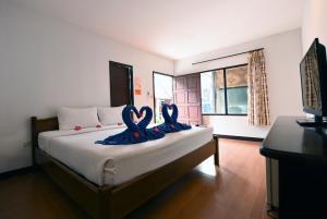 Katil atau katil-katil dalam bilik di Phi Phi Twin Palms Bungalow