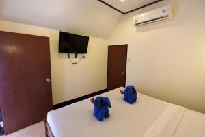 En eller flere senge i et værelse på Phi Phi Twin Palms Bungalow