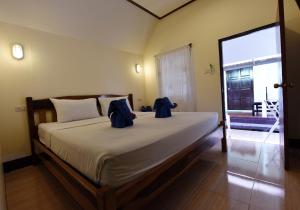 Katil atau katil-katil dalam bilik di Phi Phi Twin Palms Bungalow