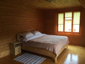 Postel nebo postele na pokoji v ubytování Chalet TysaBorkut
