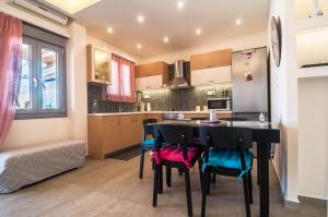 a kitchen with a table and chairs in a room at Viglaki House in Naxos Chora