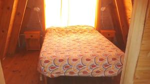 Una cama o camas en una habitación de Cabañas Delicias del Condado